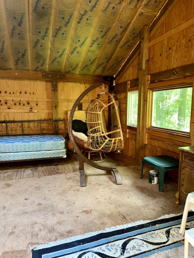 23266 Hayes Rd, Big Rapids, MI 49307 - bedroom featuring vaulted ceiling, wooden walls, and carpet flooring