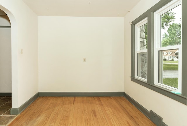 7125 Edwards Rd, Michigan, MI 48111 - spare room featuring arched walkways and wood finished floors