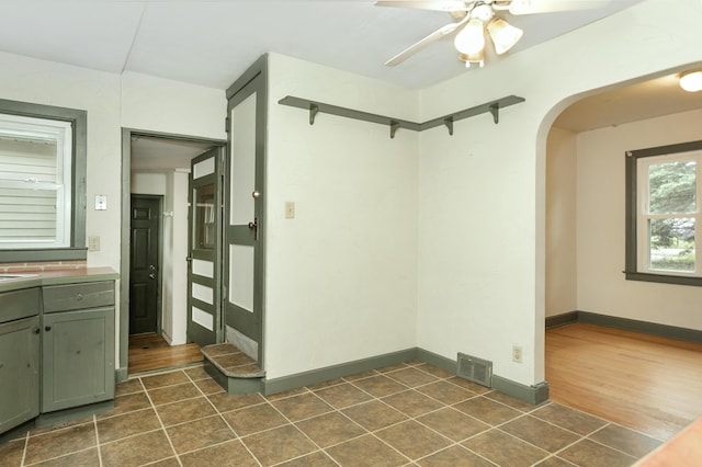 7125 Edwards Rd, Michigan, MI 48111 - empty room with arched walkways, dark tile patterned floors, and ceiling fan