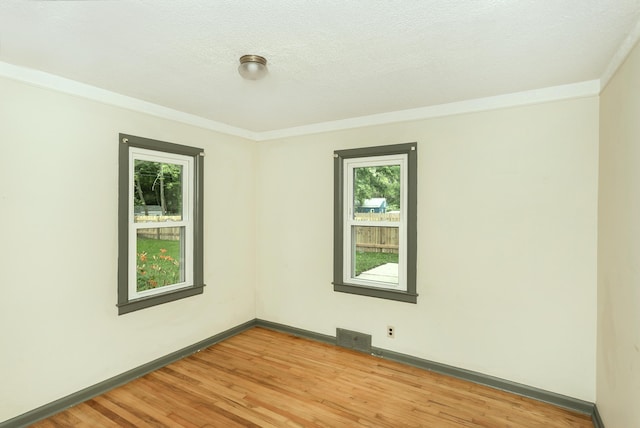 7125 Edwards Rd, Michigan, MI 48111 - spare room featuring healthy amount of natural light, light wood finished floors, and ornamental molding