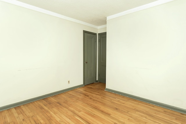 7125 Edwards Rd, Michigan, MI 48111 - unfurnished room featuring light wood-style flooring, crown molding, and a textured ceiling