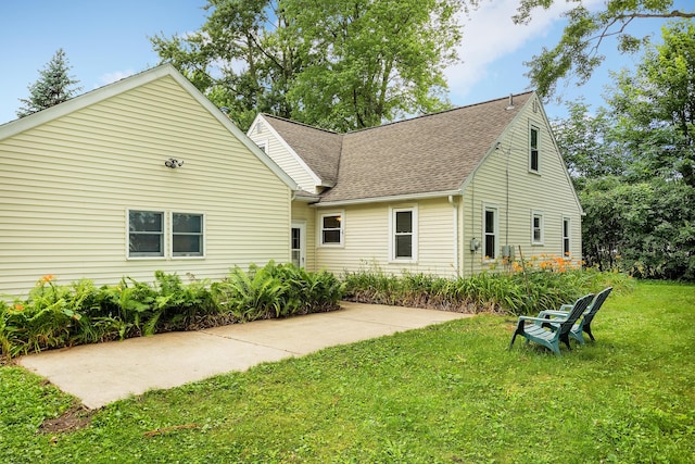 7125 Edwards Rd, Michigan, MI 48111 - back of property featuring a yard and a shingled roof