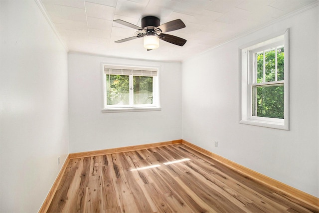 1722 Benson, Fountain, MI 49410 - empty room featuring ornamental molding, light wood finished floors, and ceiling fan
