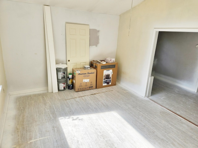 730 W Mohawk Trl, White Cloud, MI 49349 - unfurnished room featuring wood finished floors and baseboards