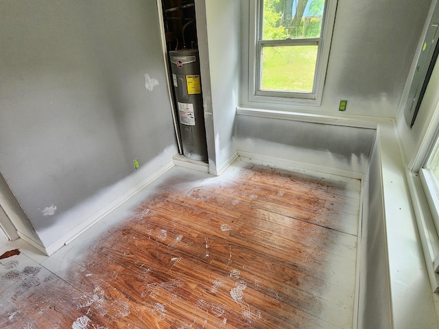 730 W Mohawk Trl, White Cloud, MI 49349 - bathroom featuring water heater and baseboards