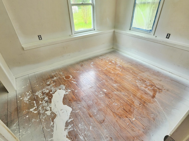 730 W Mohawk Trl, White Cloud, MI 49349 - detailed view of wood finished floors and baseboards