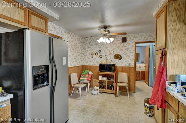 3423 Nichols Rd, Auburn Hills, MI 48326 - kitchen with stainless steel fridge with ice dispenser, black microwave, a wainscoted wall, a ceiling fan, and wallpapered walls