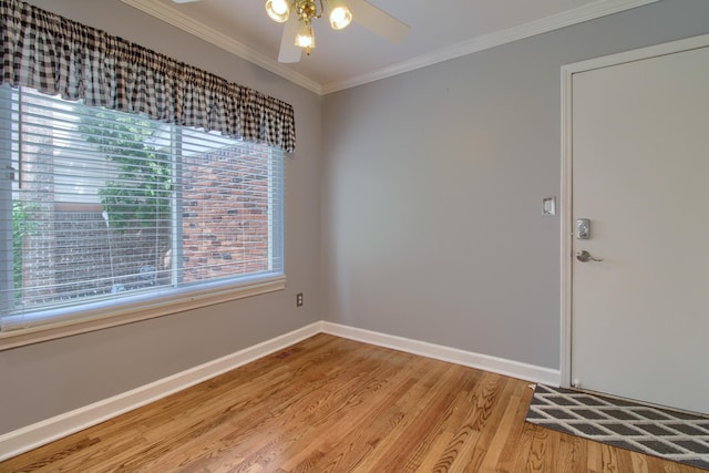 13947 Ashurst St, Livonia, MI 48154 - unfurnished room featuring light wood-style floors, ornamental molding, and a ceiling fan