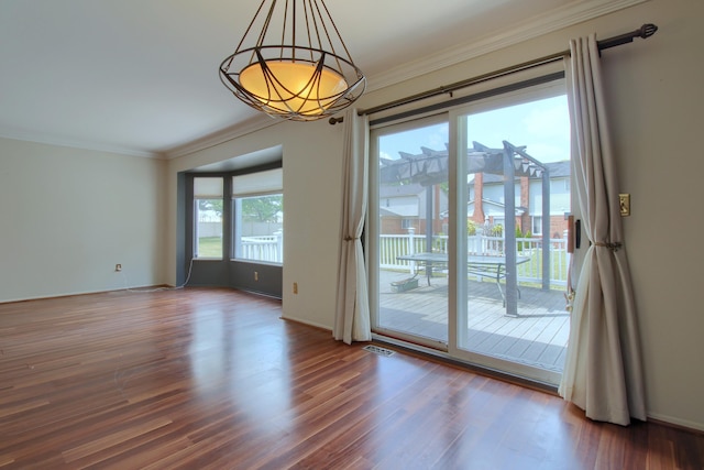 13947 Ashurst St, Livonia, MI 48154 - spare room featuring crown molding and wood finished floors