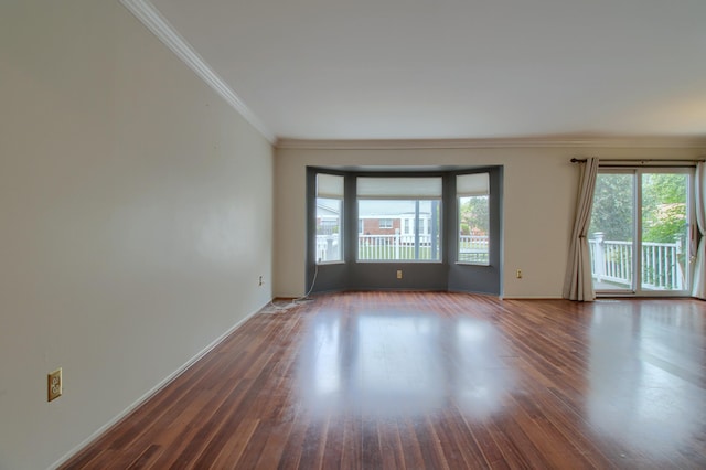 13947 Ashurst St, Livonia, MI 48154 - empty room with plenty of natural light, ornamental molding, and wood finished floors