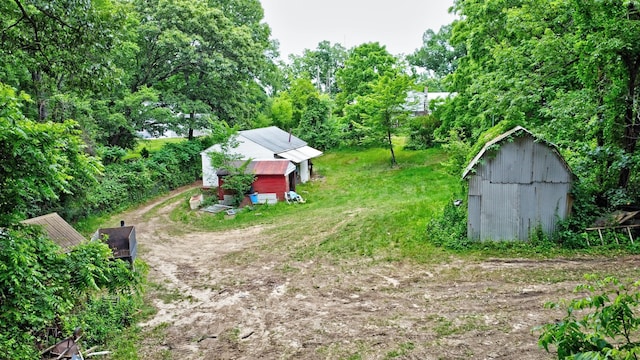 3618 Rohr Rd, Lake Orion, MI 48359 - view of yard featuring a storage unit
