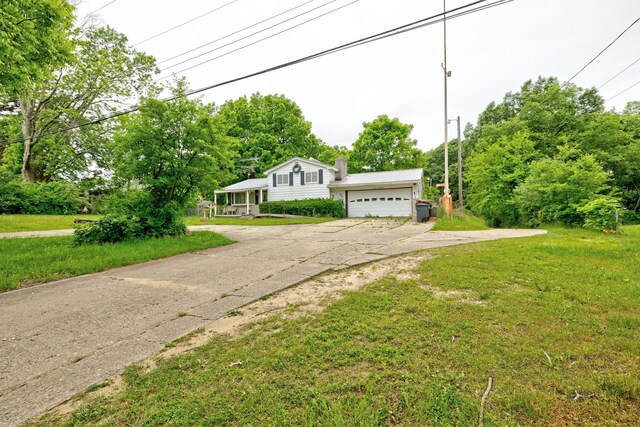 3618 Rohr Rd, Lake Orion, MI 48359 - tri-level home with a front yard and a chimney
