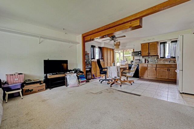 3618 Rohr Rd, Lake Orion, MI 48359 - living room with light tile patterned floors, light colored carpet, and ceiling fan