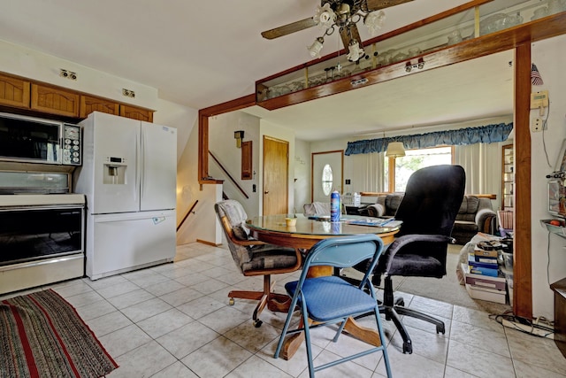3618 Rohr Rd, Lake Orion, MI 48359 - dining room featuring ceiling fan, light tile patterned flooring, and stairs