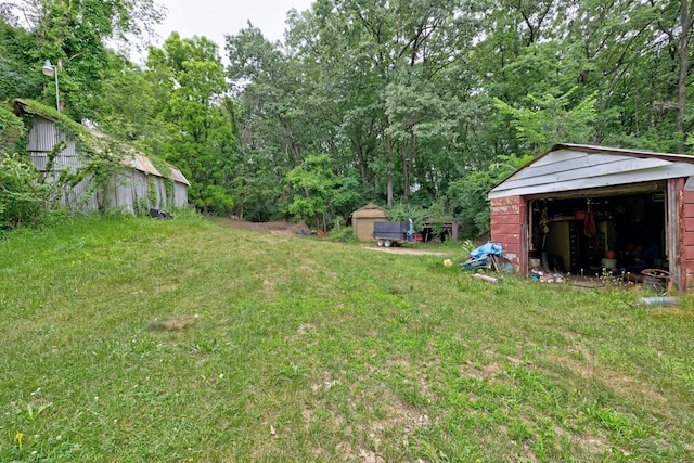 3618 Rohr Rd, Lake Orion, MI 48359 - view of grassy yard with an outdoor structure and a garage