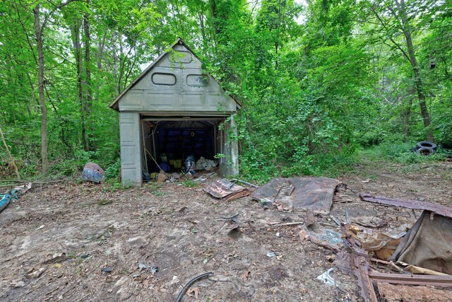 3618 Rohr Rd, Lake Orion, MI 48359 - view of outbuilding featuring a wooded view
