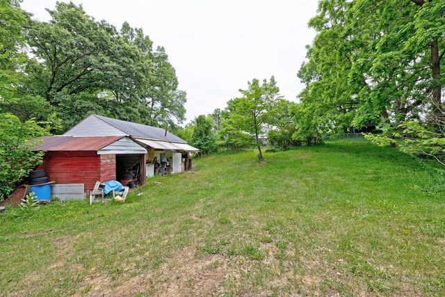 3618 Rohr Rd, Lake Orion, MI 48359 - view of grassy yard with an outdoor structure