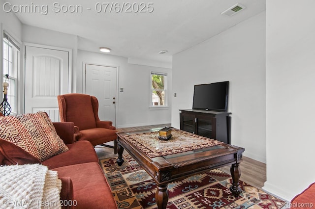 3277 9th St, Monroe, MI 48162 - living area featuring wood finished floors and baseboards