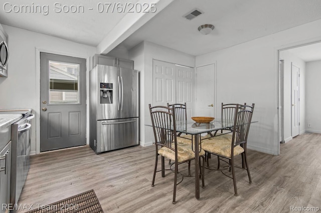 3277 9th St, Monroe, MI 48162 - dining space featuring light wood-type flooring and baseboards
