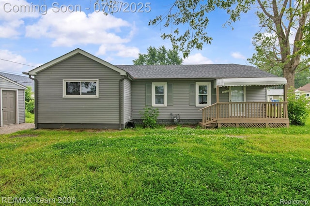 3277 9th St, Monroe, MI 48162 - back of house featuring a lawn, a shingled roof, and a deck