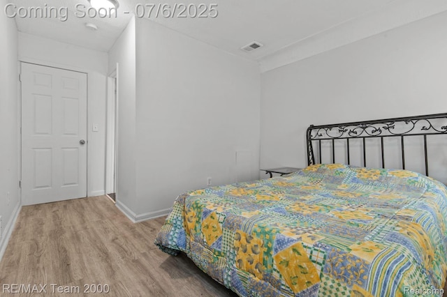 3277 9th St, Monroe, MI 48162 - bedroom featuring wood finished floors and baseboards