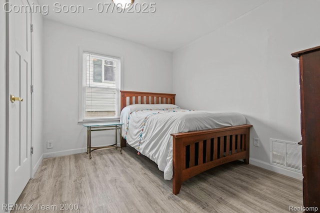 3277 9th St, Monroe, MI 48162 - bedroom with wood finished floors and baseboards
