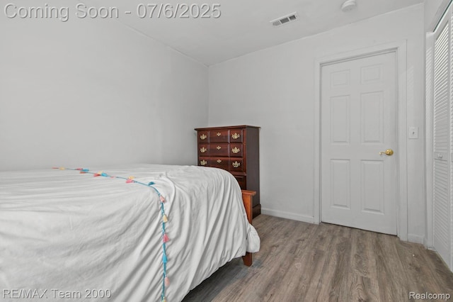 3277 9th St, Monroe, MI 48162 - bedroom with wood finished floors and baseboards