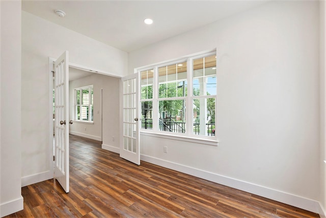209 N 7th St, Ann Arbor, MI 48103 - empty room with french doors, dark wood-style floors, recessed lighting, and a smoke detector