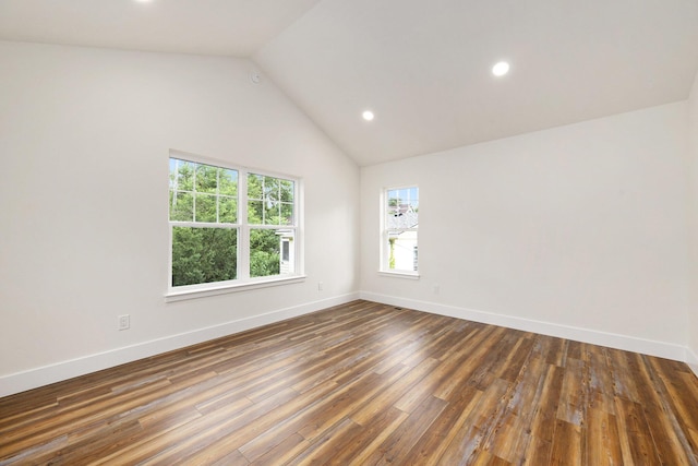 209 N 7th St, Ann Arbor, MI 48103 - empty room featuring plenty of natural light, recessed lighting, wood finished floors, and vaulted ceiling