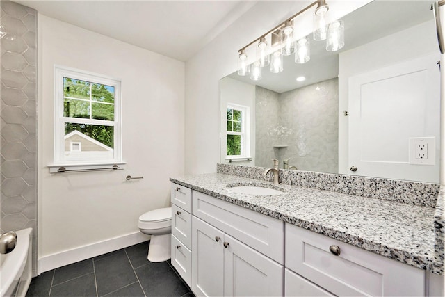 209 N 7th St, Ann Arbor, MI 48103 - bathroom with healthy amount of natural light, vanity, and tile patterned flooring