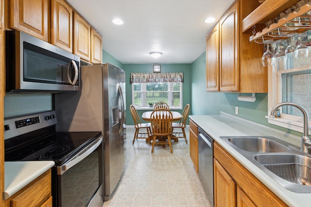 200 Begole Rd, Milan, MI 48160 - kitchen with stainless steel appliances, light countertops, brown cabinets, and recessed lighting