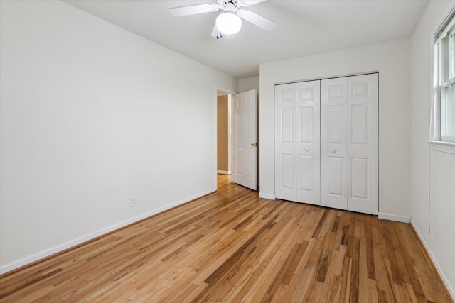 200 Begole Rd, Milan, MI 48160 - unfurnished bedroom with light wood-style flooring, a closet, and ceiling fan