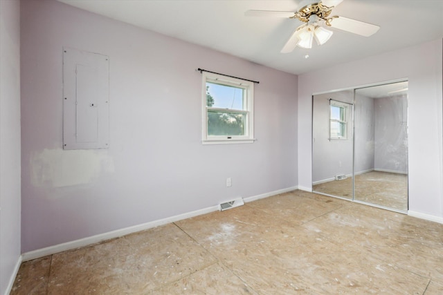 200 Begole Rd, Milan, MI 48160 - unfurnished bedroom with electric panel, a closet, and ceiling fan