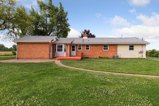 200 Begole Rd, Milan, MI 48160 - back of property with brick siding, a yard, and a chimney