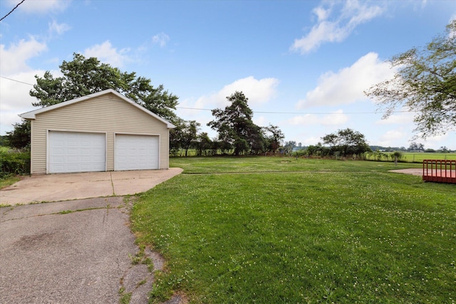 200 Begole Rd, Milan, MI 48160 - view of grassy yard with a detached garage and an outdoor structure