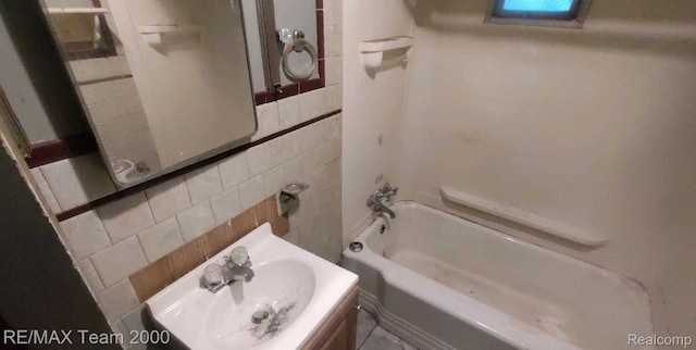 3505 Herrick St, Flint, MI 48503 - bathroom with washtub / shower combination, tile walls, and tasteful backsplash