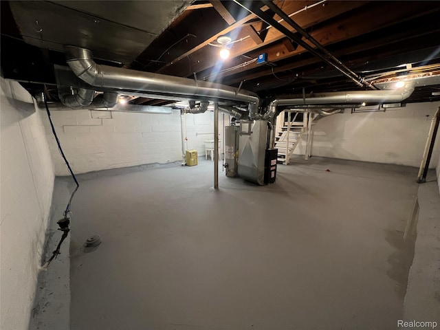 2613 Flushing Rd, Flushing, MI 48504 - unfinished below grade area featuring heating unit and gas water heater