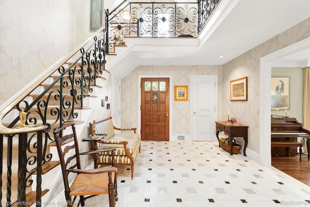 633 Hawthorne St, Birmingham, MI 48009 - entryway featuring a high ceiling, stairway, and wallpapered walls