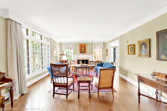 633 Hawthorne St, Birmingham, MI 48009 - living area featuring wood finished floors, crown molding, and a fireplace