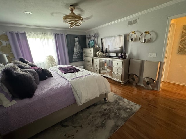 2008 Beekman Ct, Flushing, MI 48532 - bedroom with ornamental molding, wood finished floors, and a ceiling fan