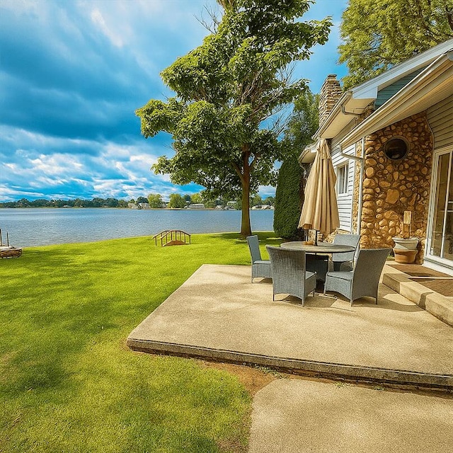 238 Cooks Lndg, Michigan Center, MI 49254 - view of patio / terrace featuring a water view and outdoor dining space
