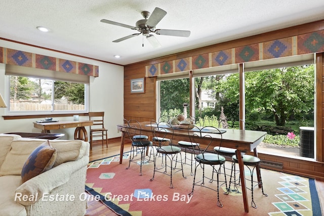 1360 Delta Dr, Saginaw, MI 48638 - dining room featuring plenty of natural light, a textured ceiling, wood finished floors, ceiling fan, and recessed lighting