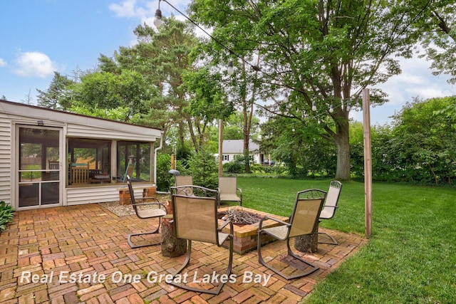 1360 Delta Dr, Saginaw, MI 48638 - view of patio / terrace featuring a sunroom and a fire pit