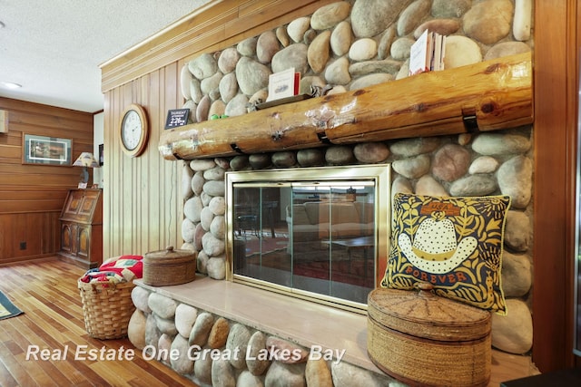 1360 Delta Dr, Saginaw, MI 48638 - detailed view of wood finished floors, a textured ceiling, and wooden walls