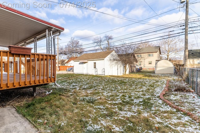 3101 Roosevelt St, Dearborn, MI 48124 - fenced backyard with a deck and an outbuilding