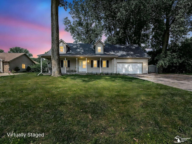 8299 Galloway Dr, Lambertville, MI 48144 - cape cod home with a porch, concrete driveway, a garage, a yard, and a storage shed