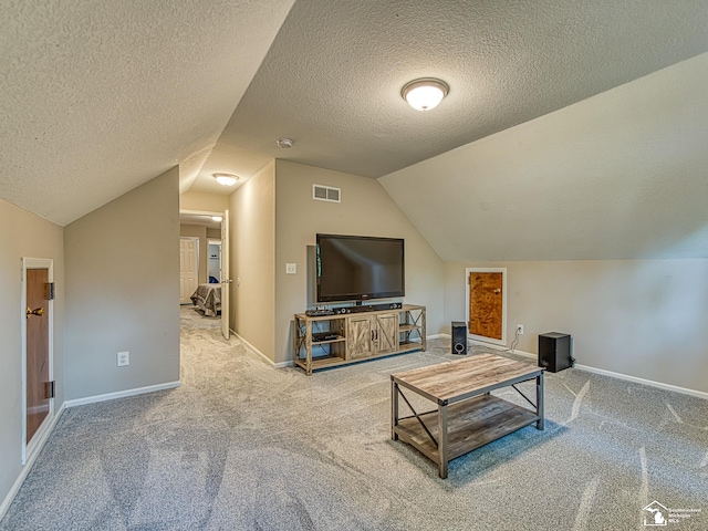 8299 Galloway Dr, Lambertville, MI 48144 - carpeted living area with vaulted ceiling and a textured ceiling