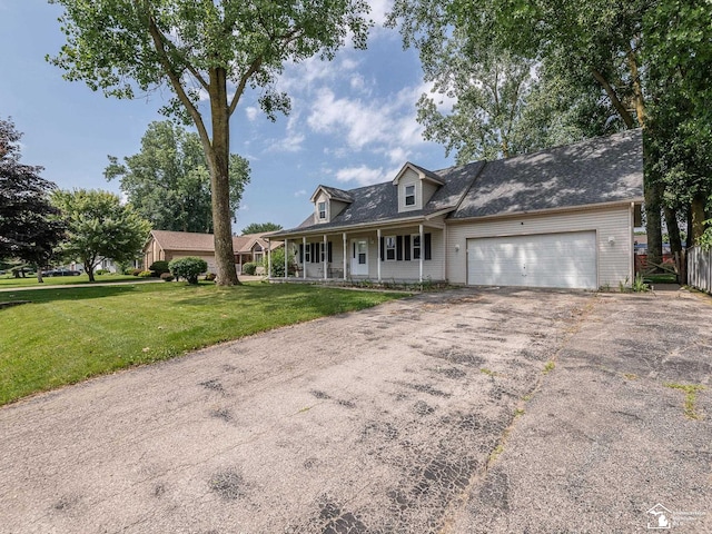 8299 Galloway Dr, Lambertville, MI 48144 - view of front of home with a porch, asphalt driveway, and an attached garage