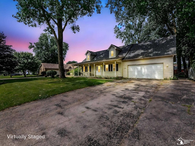 8299 Galloway Dr, Lambertville, MI 48144 - cape cod-style house with driveway, covered porch, and a garage
