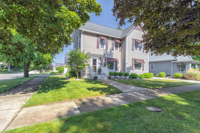 464 Kalamazoo St, South Haven, MI 49090 - view of front of house featuring a front yard